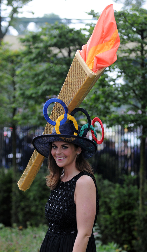 ASCOT, UNITED KINGDOM - JUNE 21: Racegoers attend day three of Royal Ascot at Ascot Racecourse on June 21, 2012 in Ascot, England. (Photo by Eamonn McCormack/Getty Images)