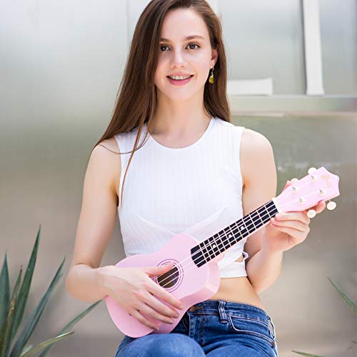 Winzz Ukelele Soprano Starter Kit para Principiante. Incluye: Funda, Afinador, Cuerdas Extra, Correa Ajustable, Púas, Pegatinas de notas, Guía de Acordes y Paño de pulido. Color: Rosa