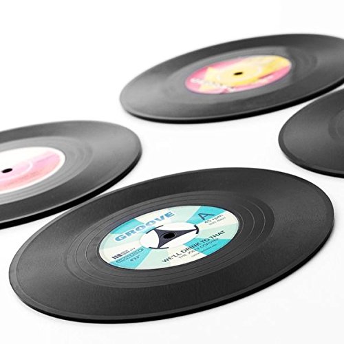 Set 4 Posavasos vinilo originales. Ideales para tu casa.Originales y divertidos. Estos vinillos decorativos son ideales para disfrutar de los tuyos escuchando buena musica sin perder el estilo retro