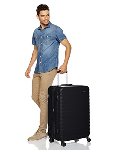 Amazon Basics - Maleta de viaje rígidaa giratoria - 78 cm, grande, Negro