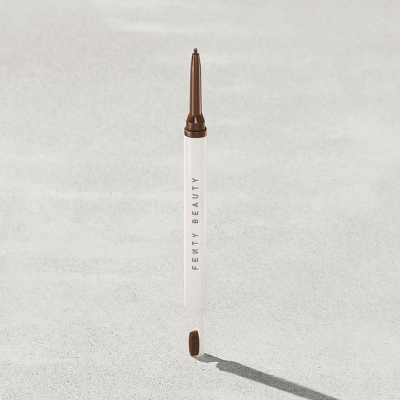  Fenty Brow MVP Ultra Fine Brow Pencil & Styler on grey background