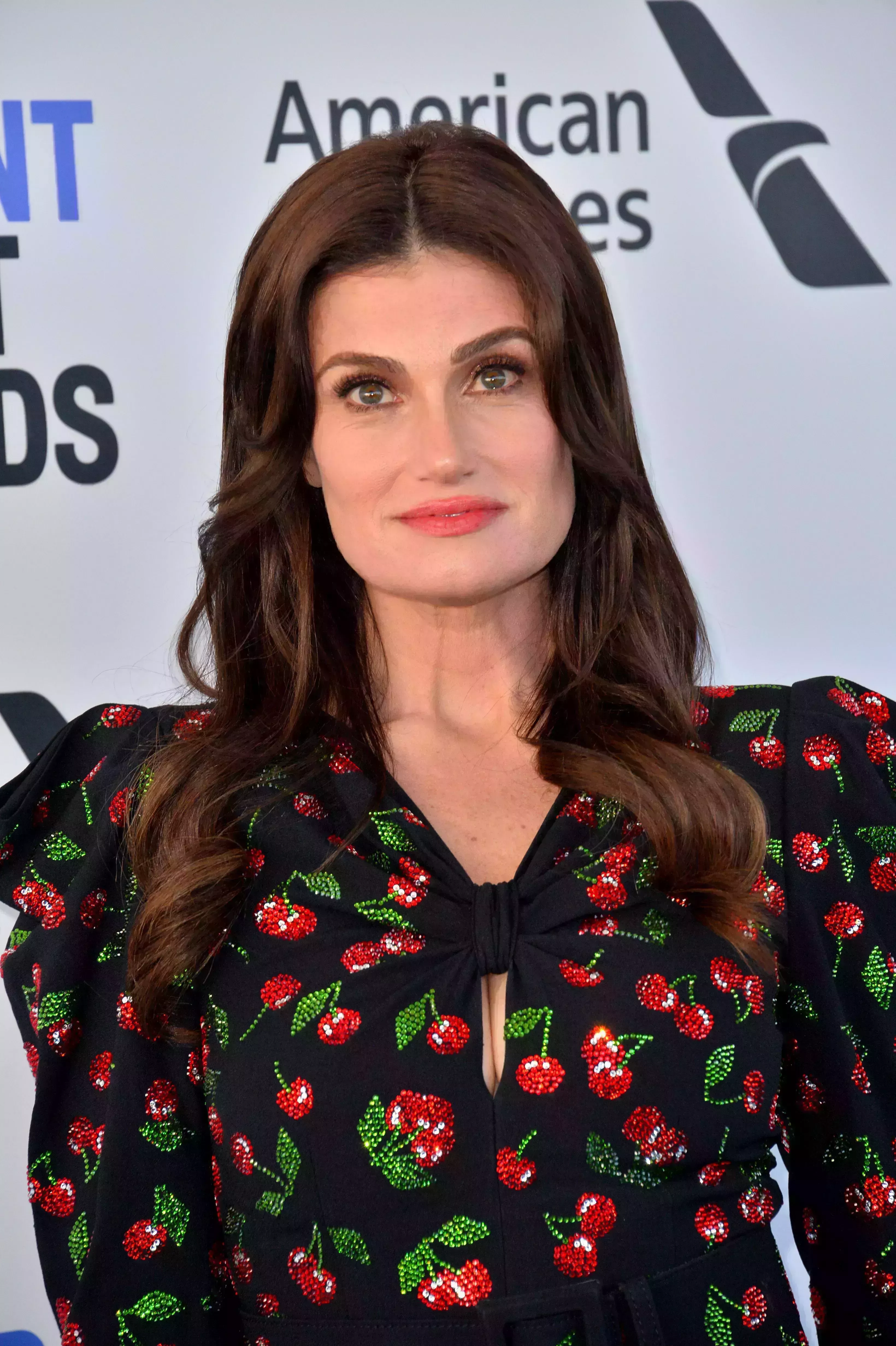 Idina Menzel’s Dark Brown Hair with Caramel Highlights