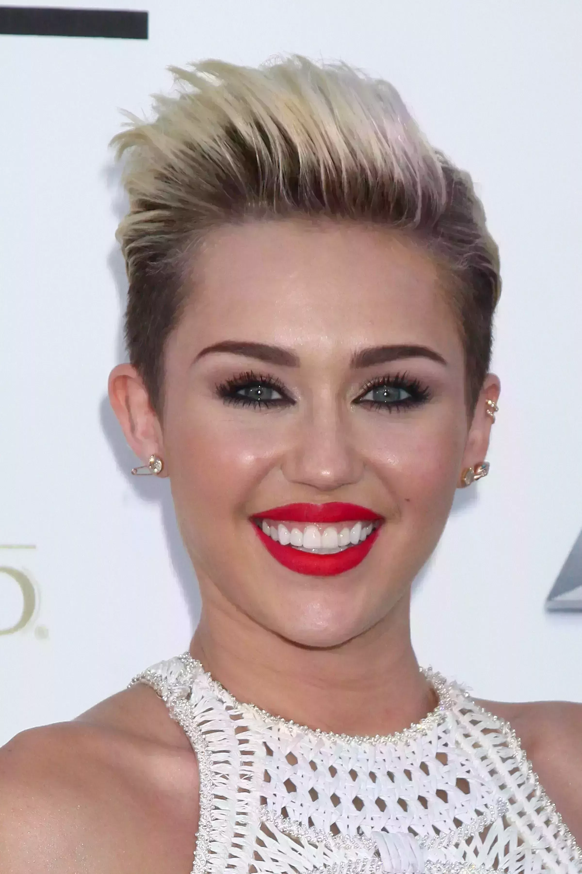 Miley Cyrus’ Platinum Blonde Faux Hawk with Dark Roots