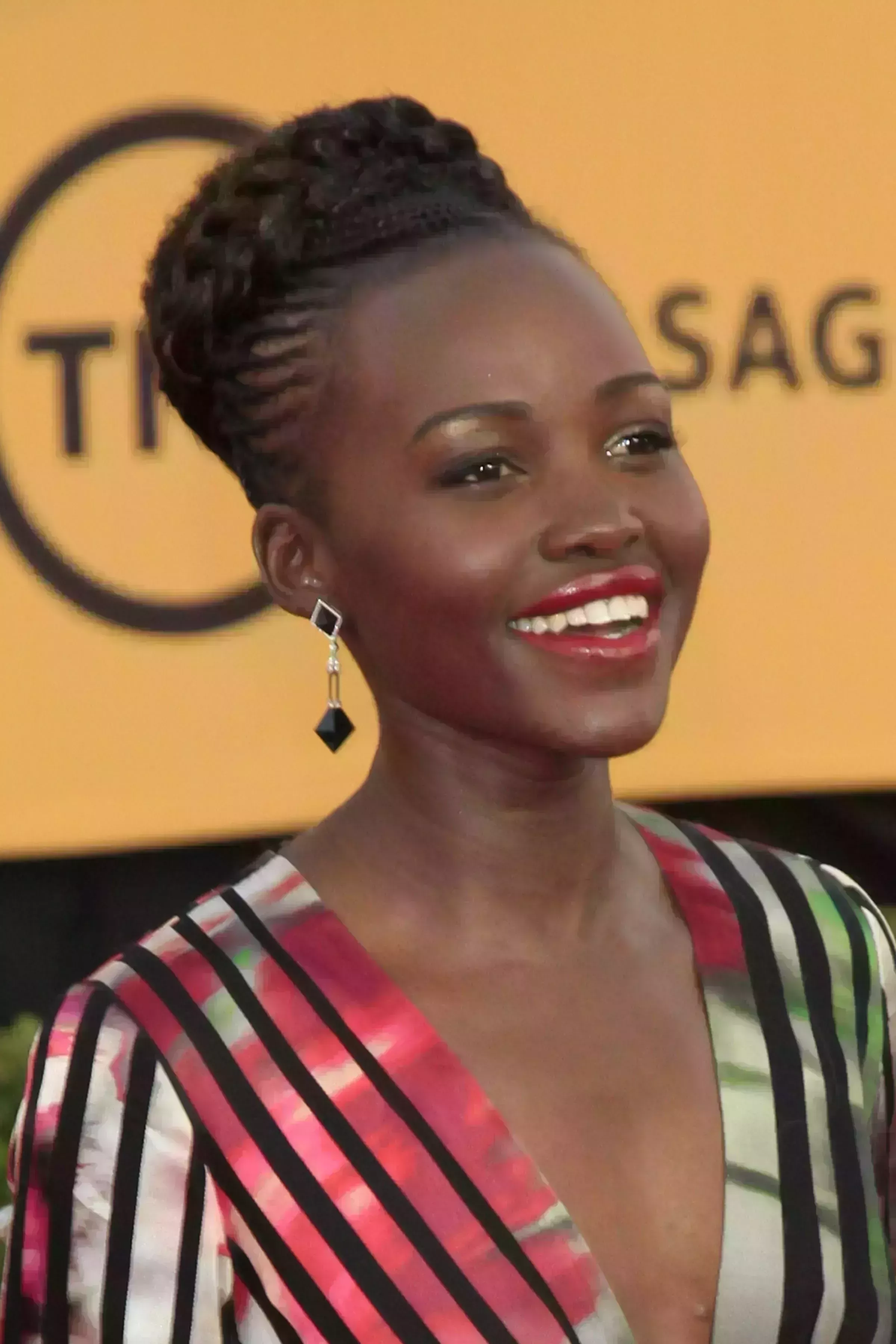 Lupita Nyong’o’s Cornrows with Braided Bun