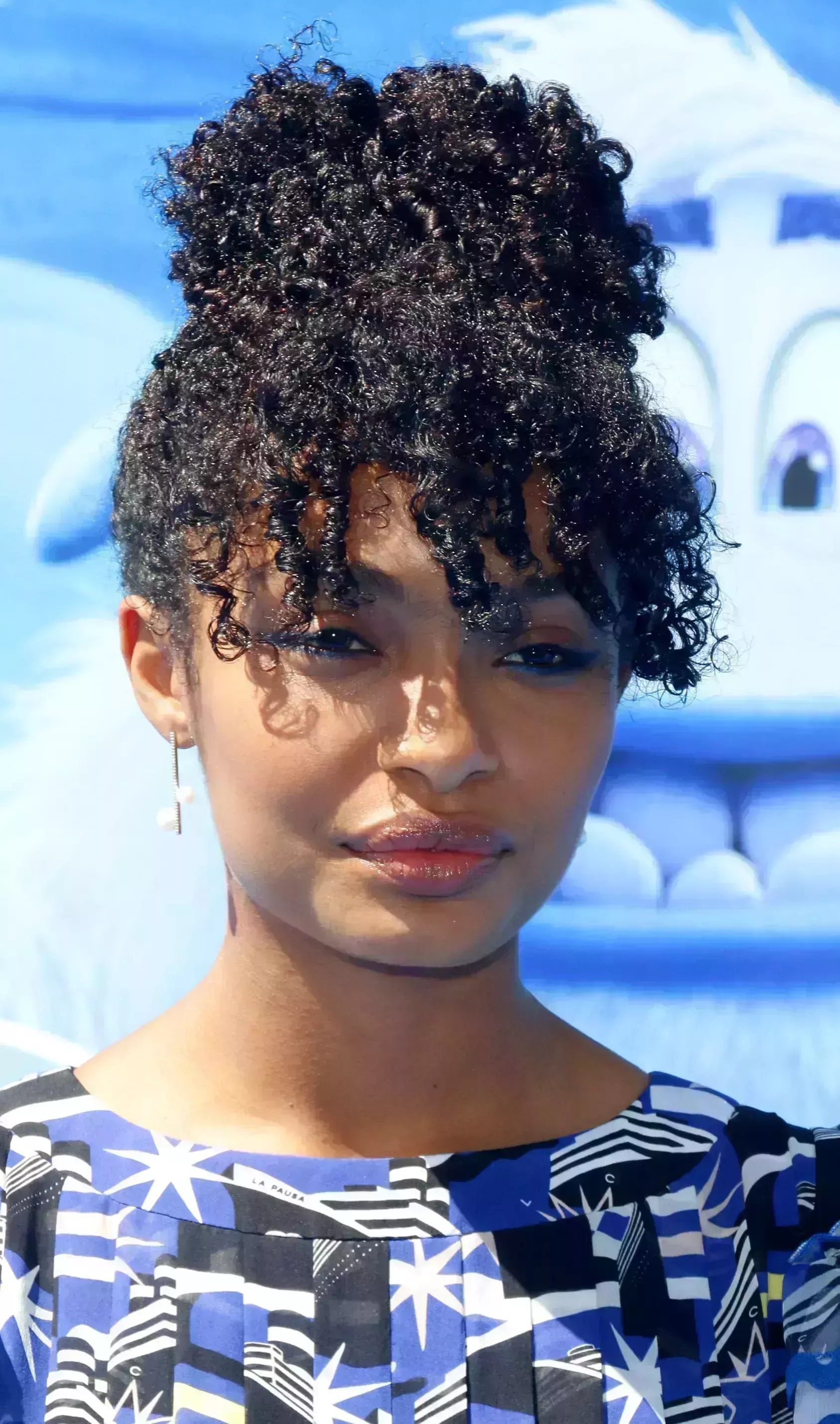 Yara Shahidi’s Curly Fringe and Bun