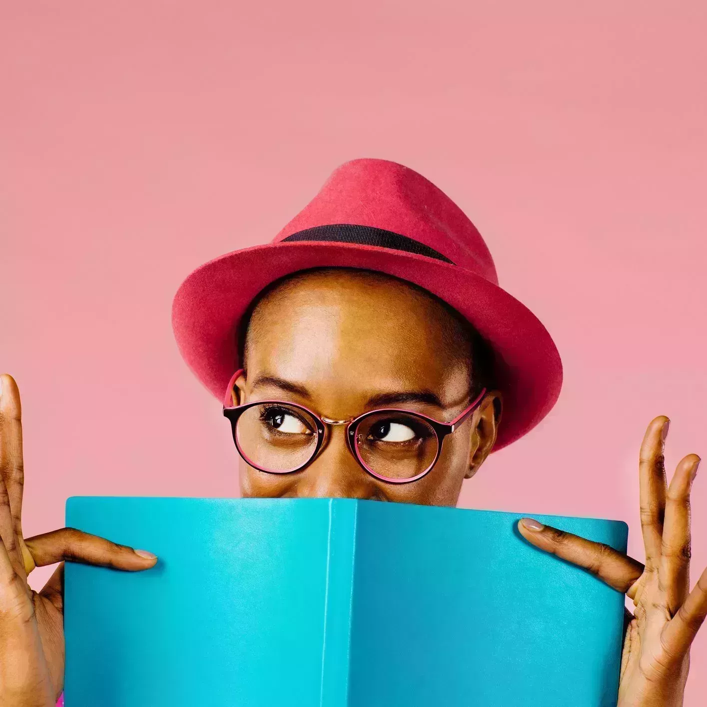 the reader portrait of a happy young woman full of joy holding a book