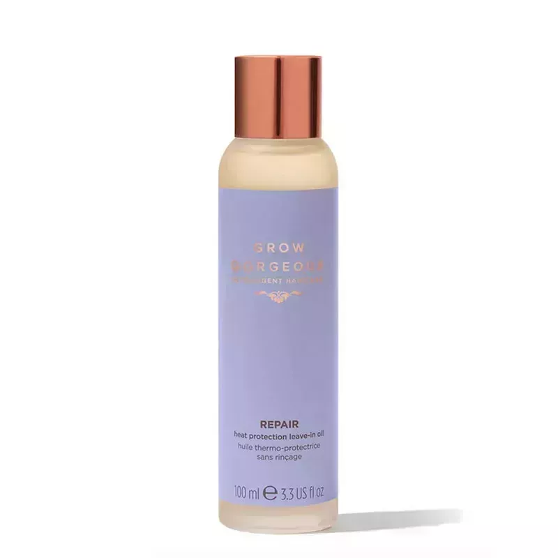 A bottle of the Grow Gorgeous Repair Heat Protection Leave-In Oil on a white background