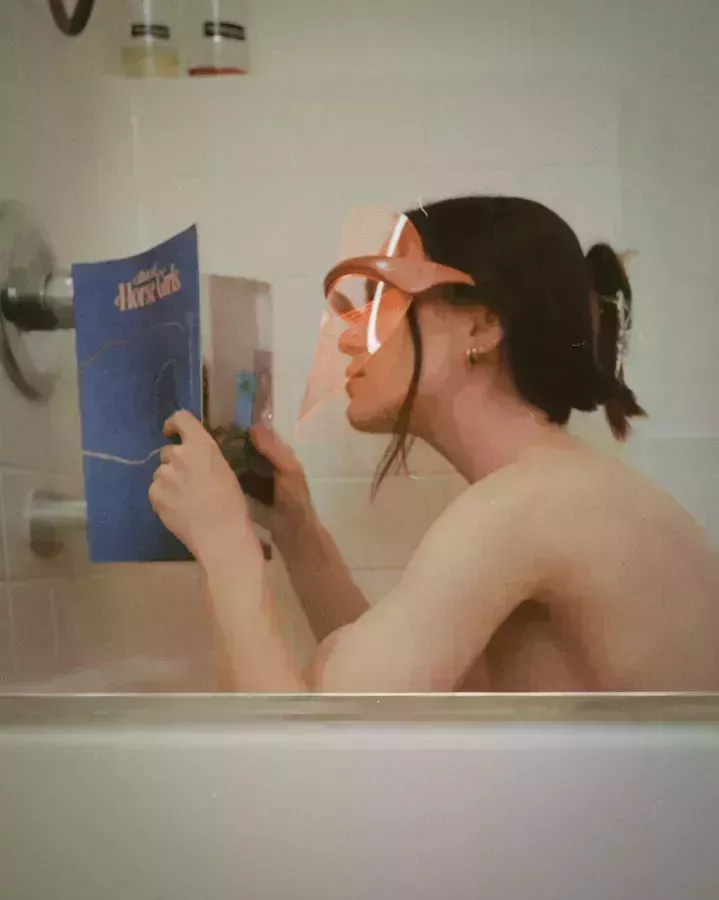 mariah leonard in dmh mask reading in tub