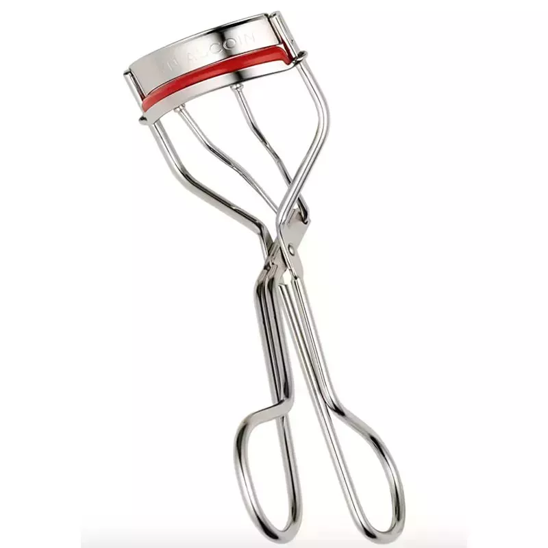 A silver Kevyn Aucoin The Eyelash Curler eyelash curling tool on a white background