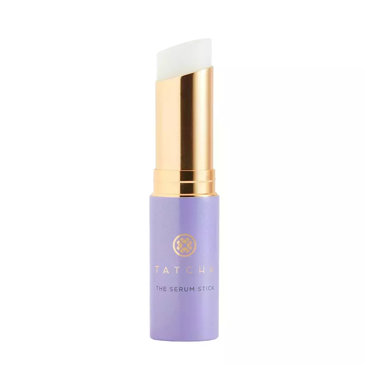 A purple bullet of Tatcha Serum Stick, opened, on a white background