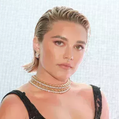 Florence Pugh in a black gown on the runway