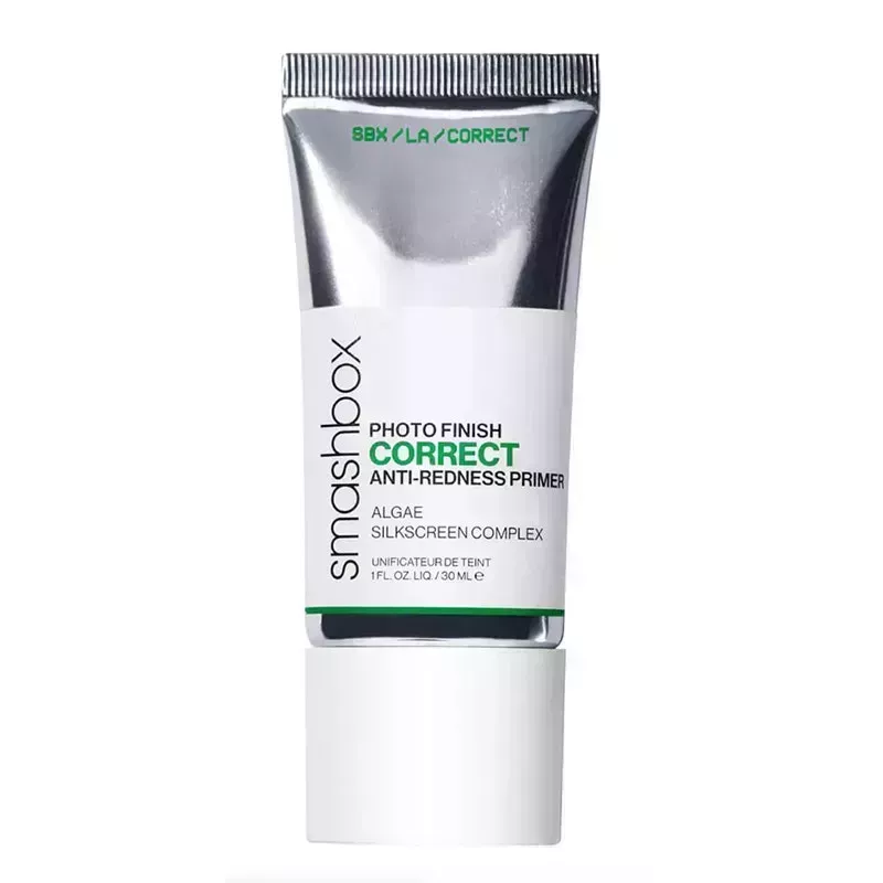 A silver tube of the Smashbox Photo Finish Correct Anti-Redness Primer on a white background