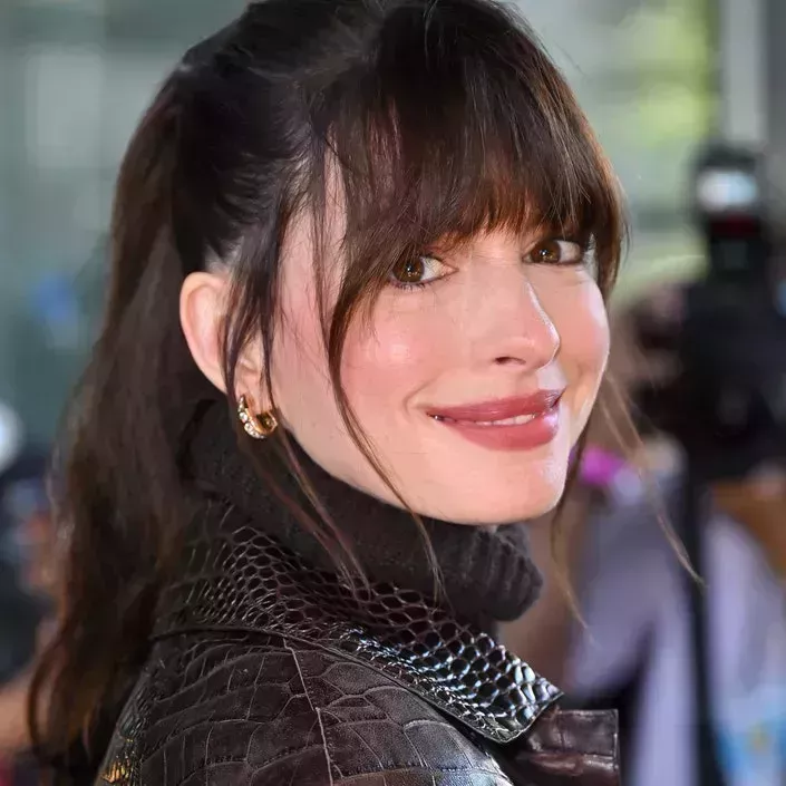 Anne Hathaway arrives to Michael Kors fashion show at Highline Stages on September 14, 2022 in New York City.