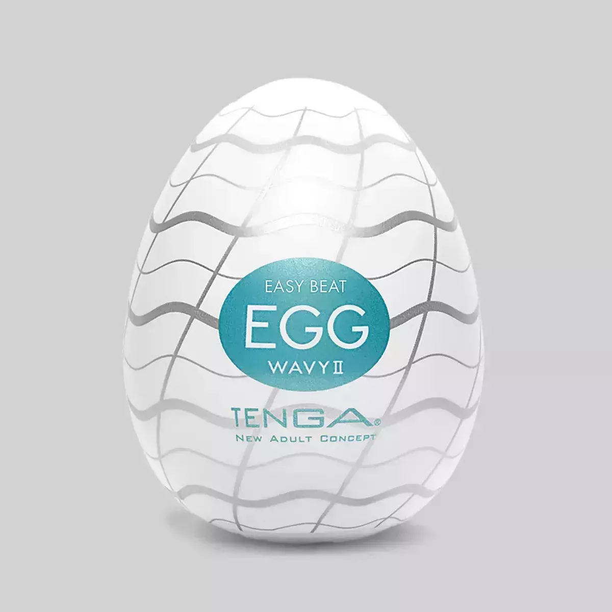 Tenga Egg Wavy II Textured Male Masturbator white egg with wavy gray grid design on gray background