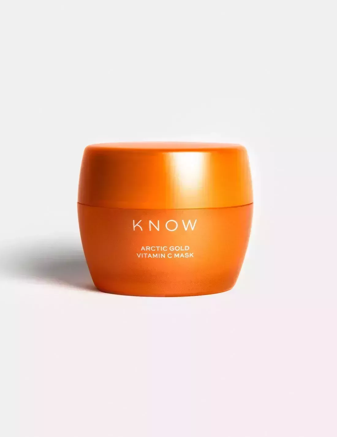 orange jar of know beauty artcic gold vitamin c mask on a light gray background