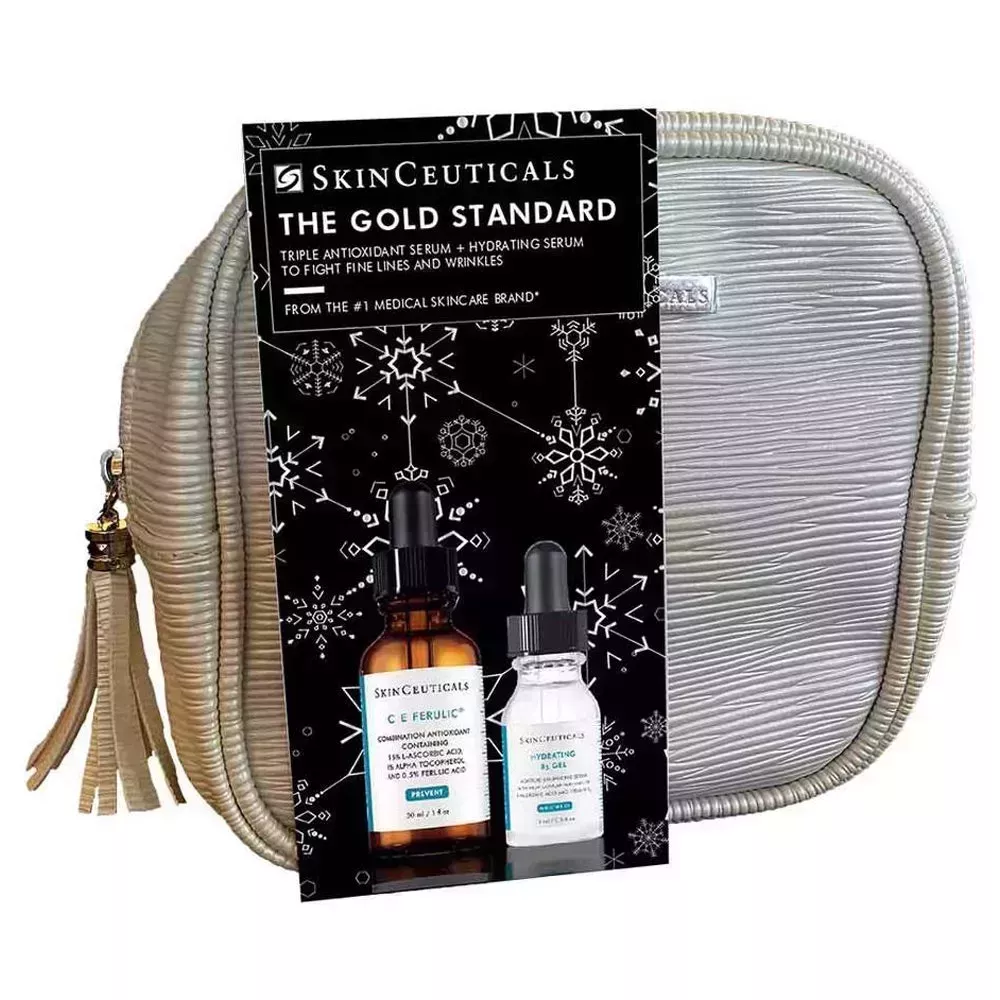 SkinCeuticals Gold Standard Holiday Set in gold bag with tassel on white background