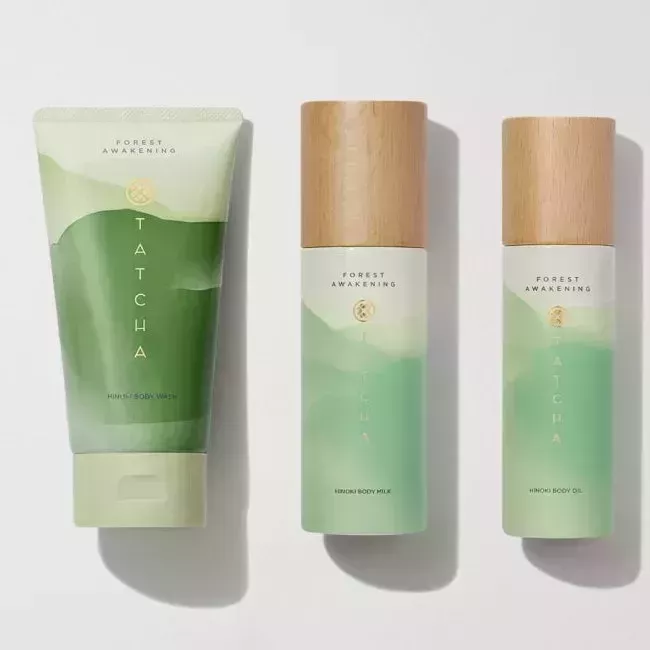 Tatcha Hinoki Body Care Trio three green body care products on gray background