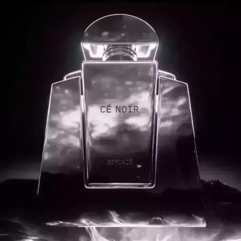 Cé Noir Eau de Parfum shiny black bottle of perfume on black background