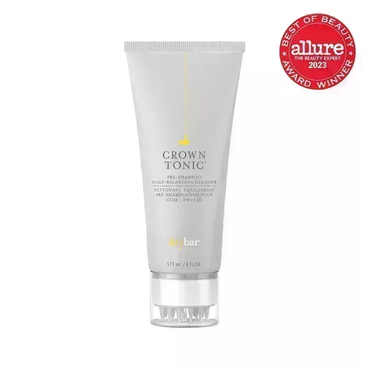 Drybar Crown Tonic Pre-Shampoo Scalp Balancing Cleanser light gray tube with scalp massager cap on white background with red Allure BoB seal in the top right corner