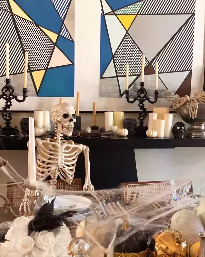 Kourtney Kardashian halloween tablescape with skeletons